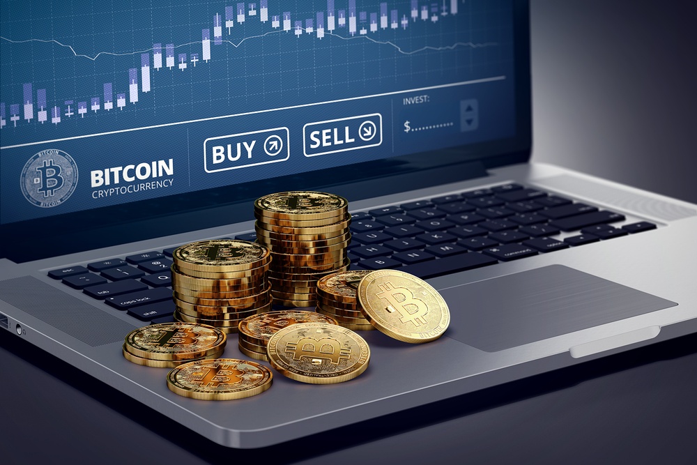 online bitcoin exchange showing buy sell buttons and bitcoin price on laptop 