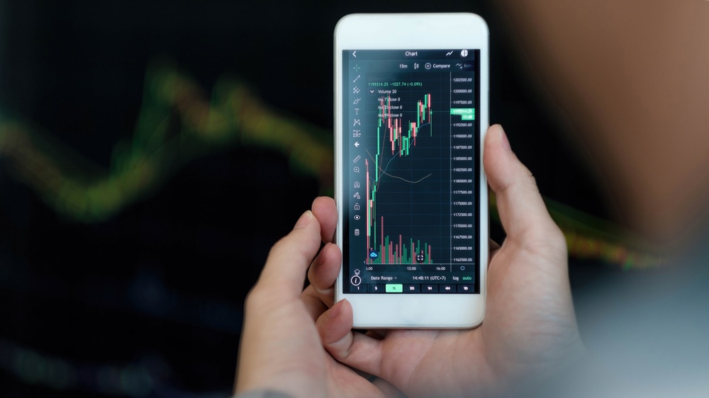 Stock investing app showing price data on smartphone 