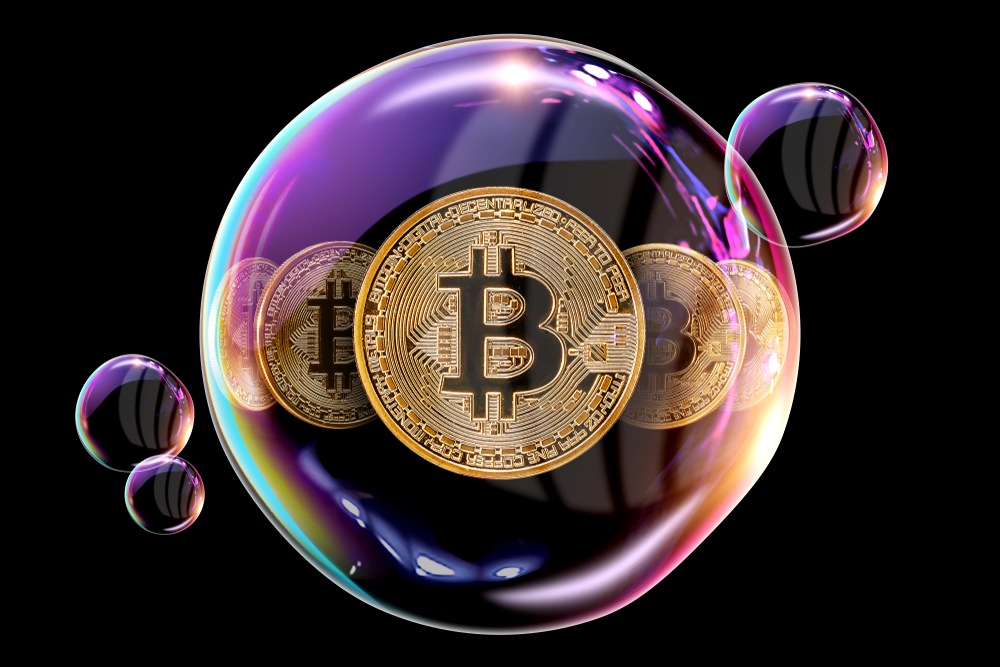 rainbow sheen on soap bubble with bitcoins reflected inside 