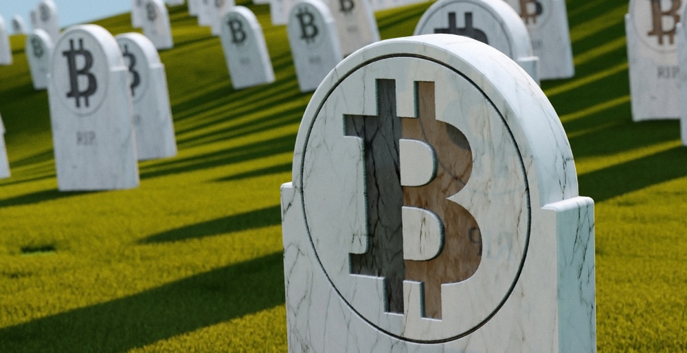 bitcoin logo on marble graves in green grass cemetary 