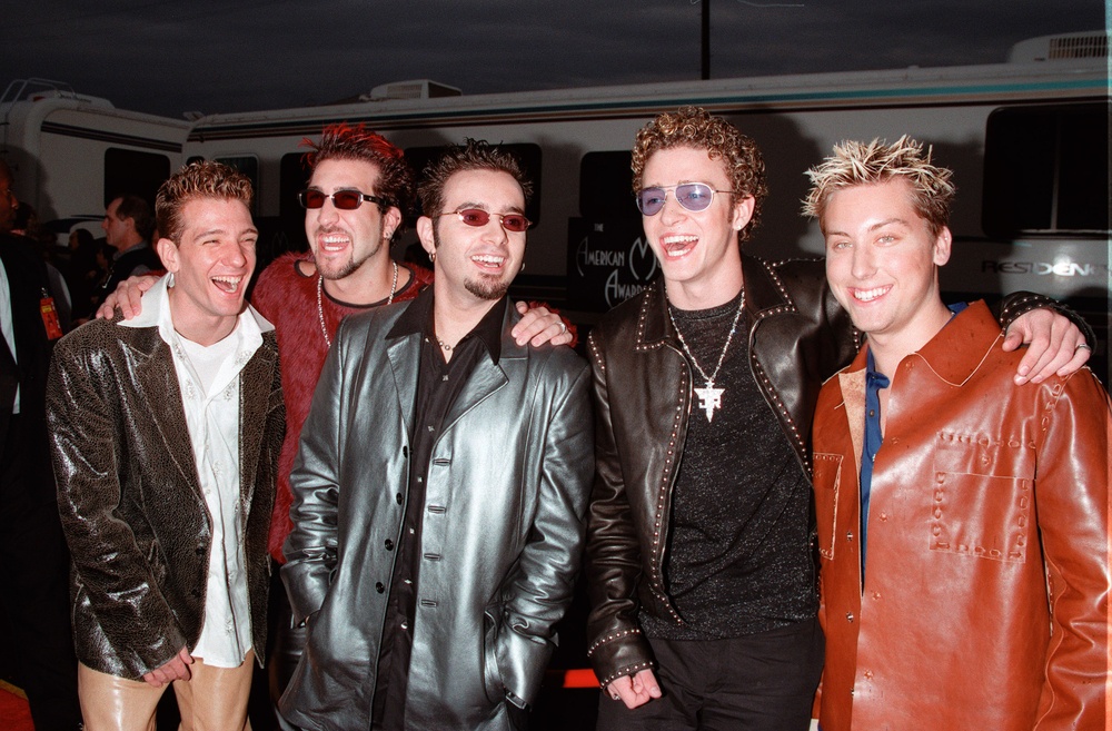 boy band NSYNC with trendy clothing and haircuts from the 90 's era