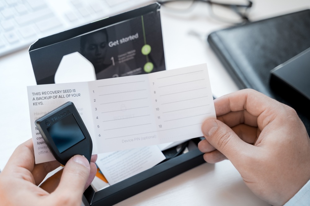 Trezor model T unboxing with hardware device and 12-word seed phrase card 