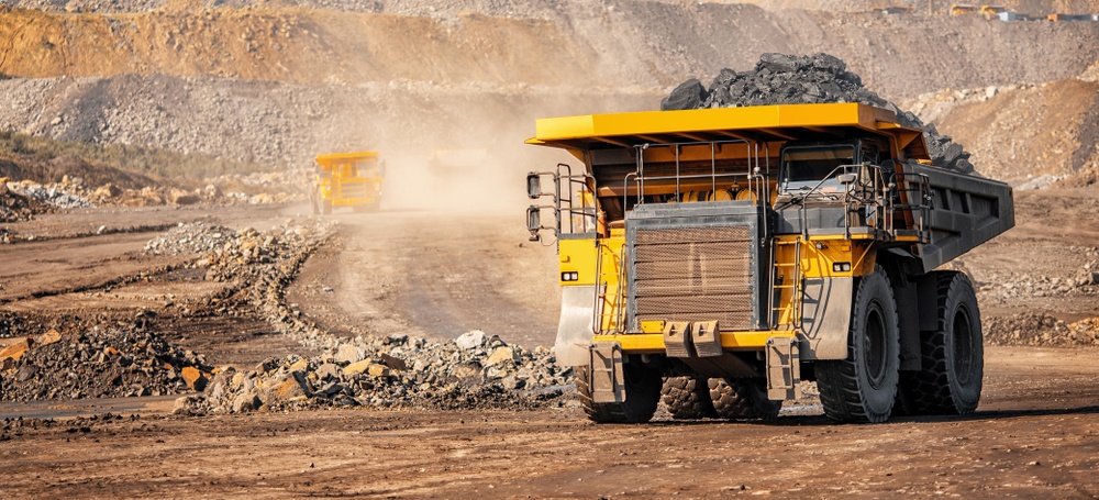 large hauler truck with rock ore at gold mine 