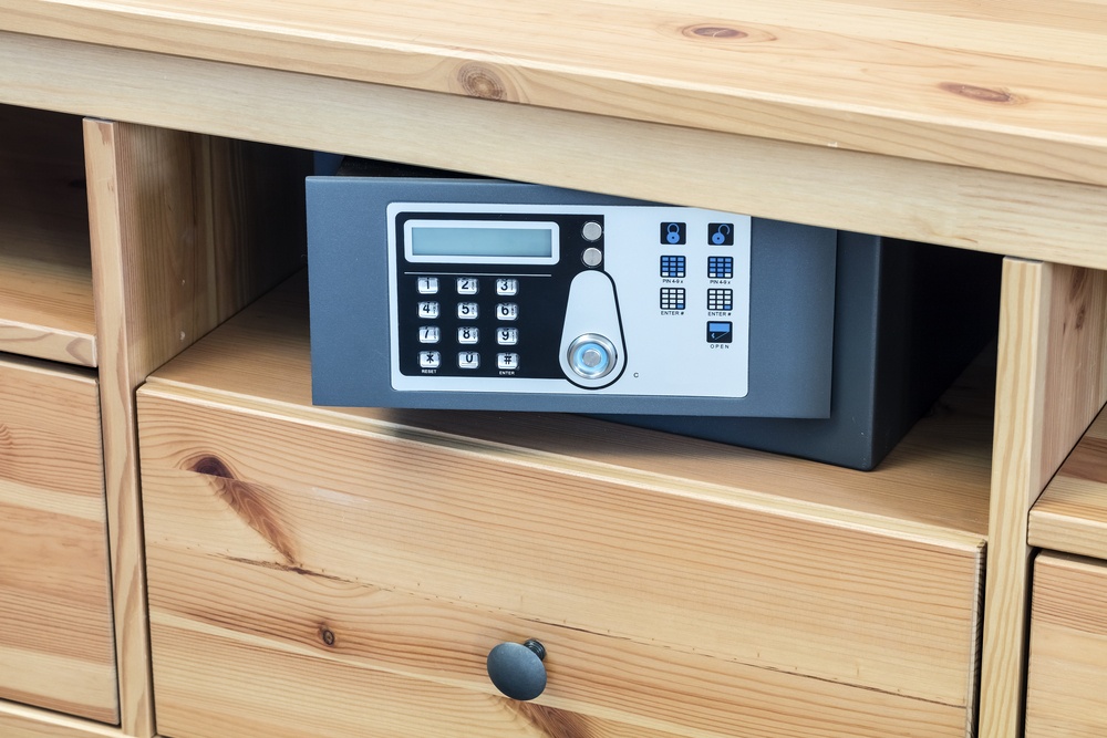 small home safe with numeric keypad in dresser drawer 