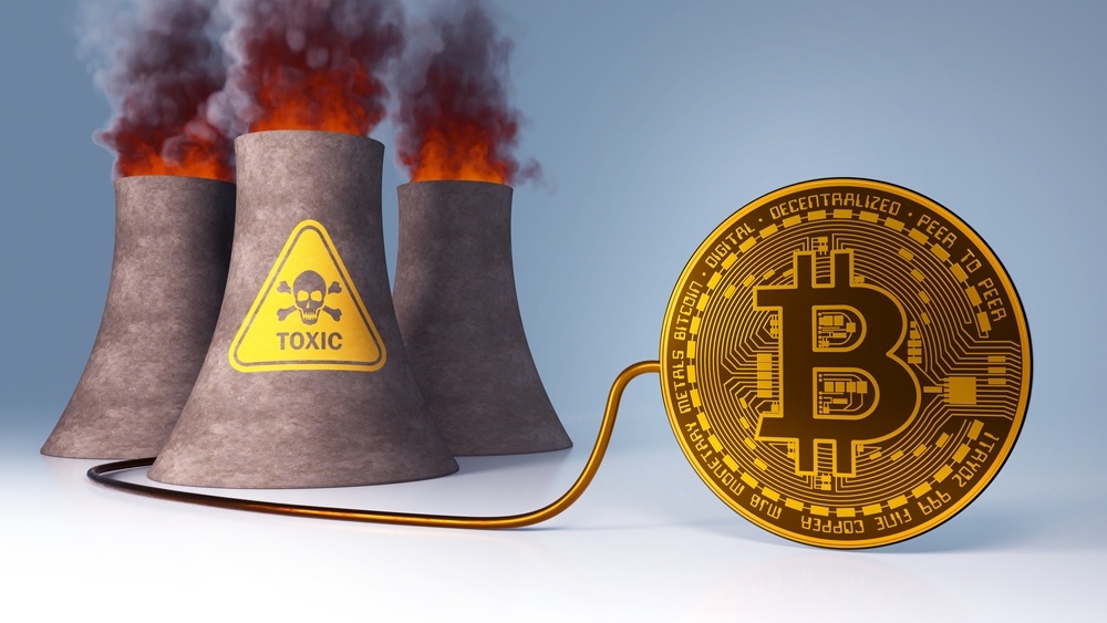 bitcoin with electrical cord plugged into nuclear reactor with toxic sign. fires with smoke 