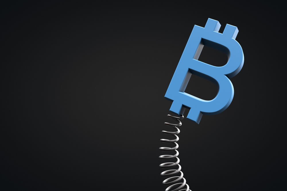 A blue bitcoin logo on a spring, indicating that it is highly volatile  