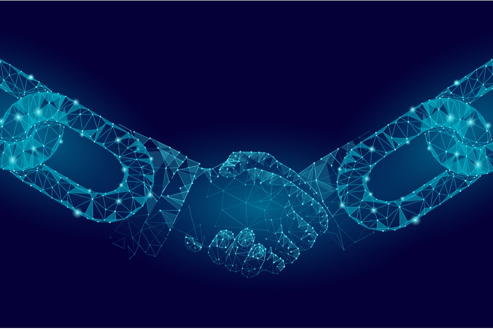 polygon outline of businessman hands with chain link outline over wrists. enterprise blockchain 