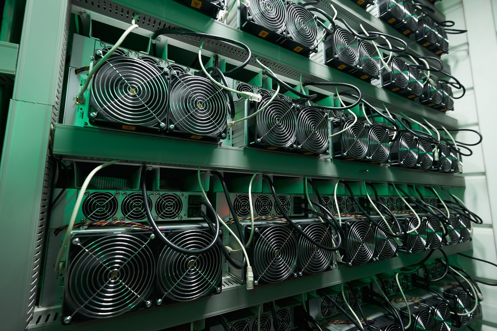 wall of asic miners at industrial facility 