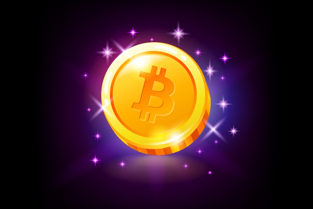 games that pay bitcoin. gold shiny bitcoin token on black and purple background. bitcoin gaming token. 