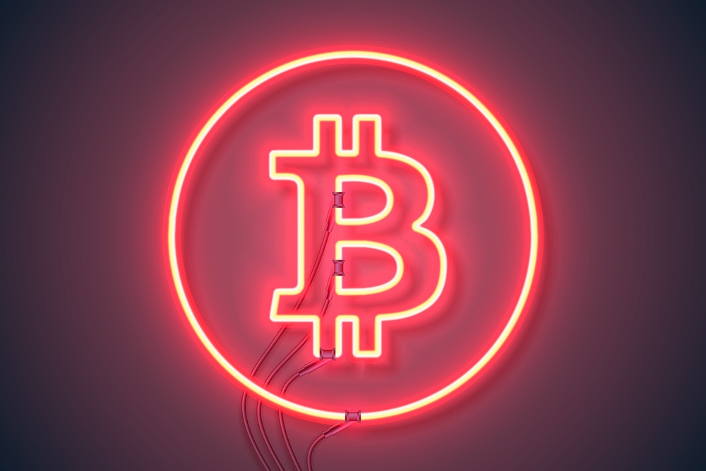 red neon light with bitcoin logo signaling opportunity ahead 