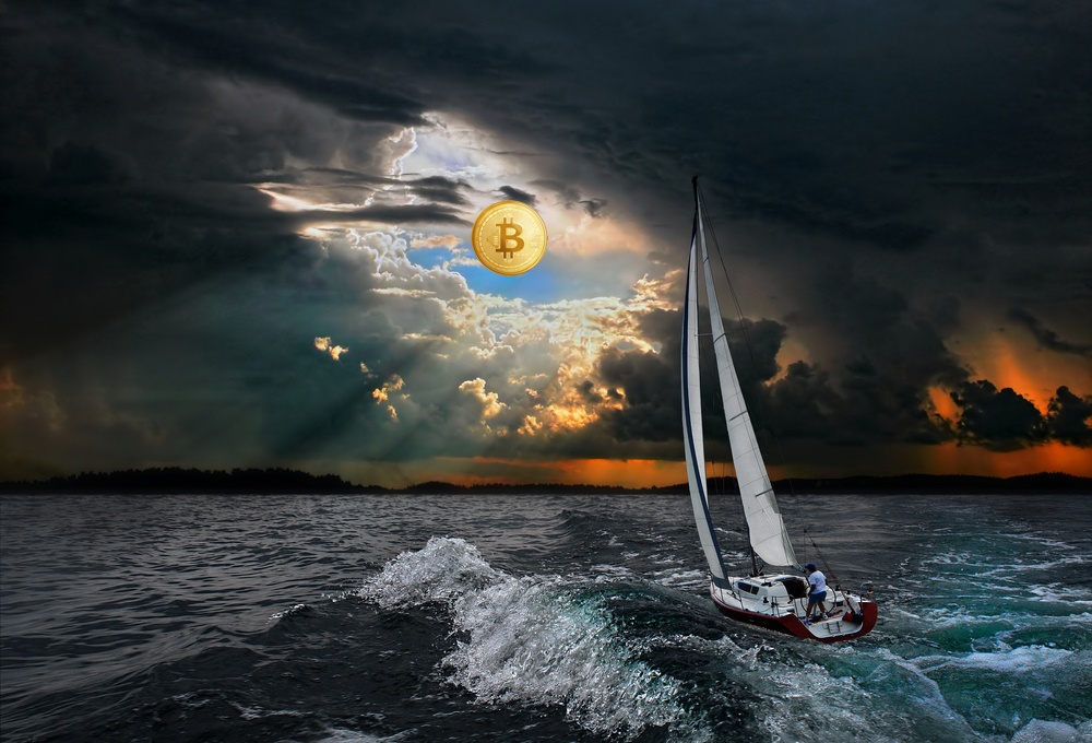 sailboat sailing through stormy seas with light filtering through clouds on the horizon and bright bitcoin in the sky 