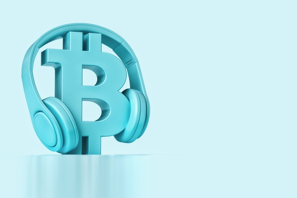 3d render of bitcoin logo in baby blue color with headphones. listening to podcasts on podcasting 2.0 apps 