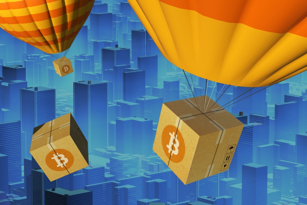 orange hot air balloons carrying cardboard packages with bitcoin logo 