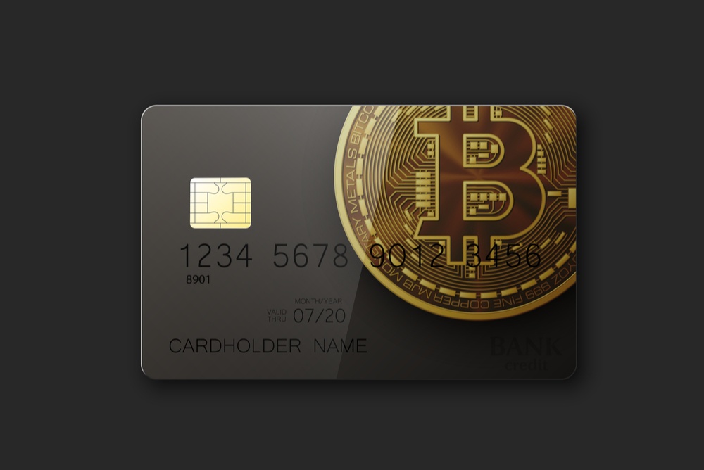 black credit card with bitcoin logo 