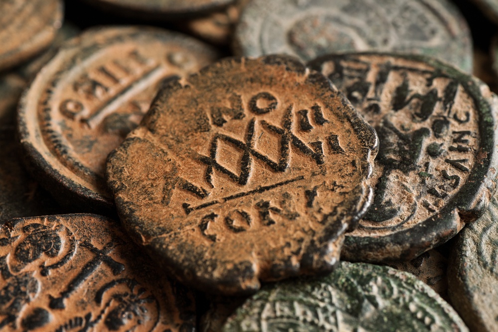 old roman coins were debased until they contained very little silver content. roman coins destroyed by corroding over time. 