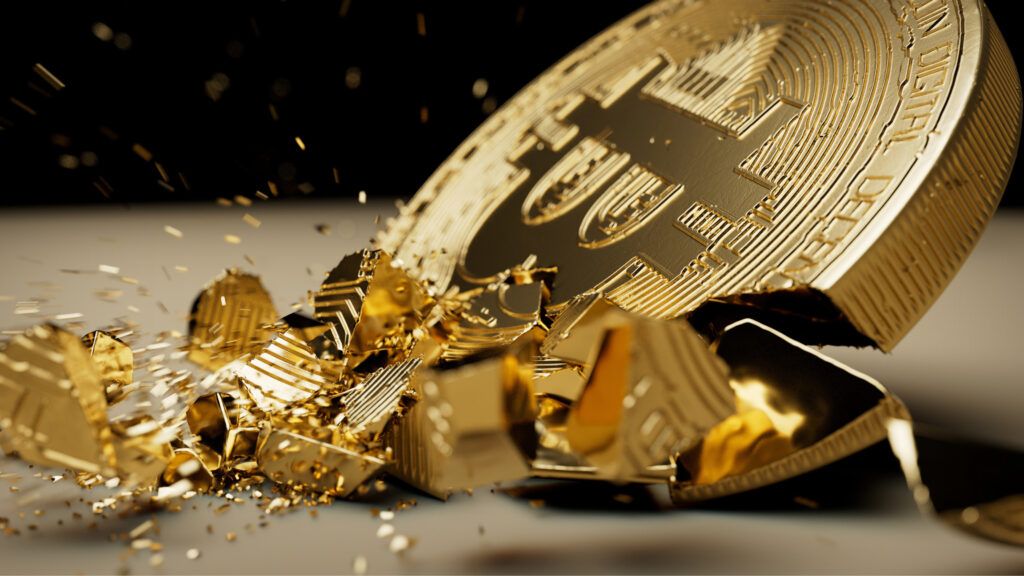 physical gold bitcoin smashed into pieces 