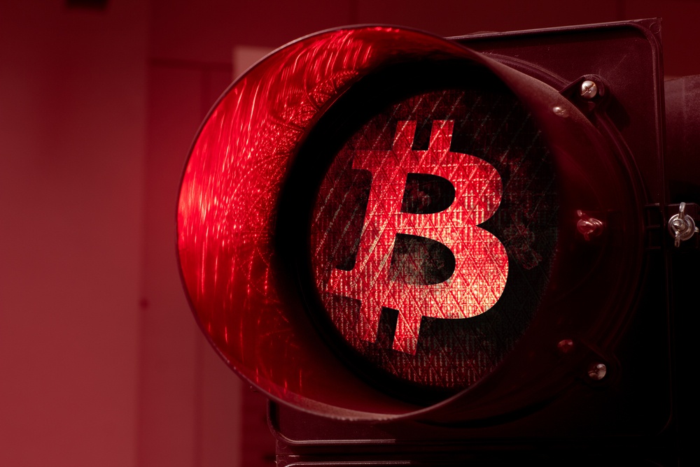 red stop light with bitcoin logo sticker 