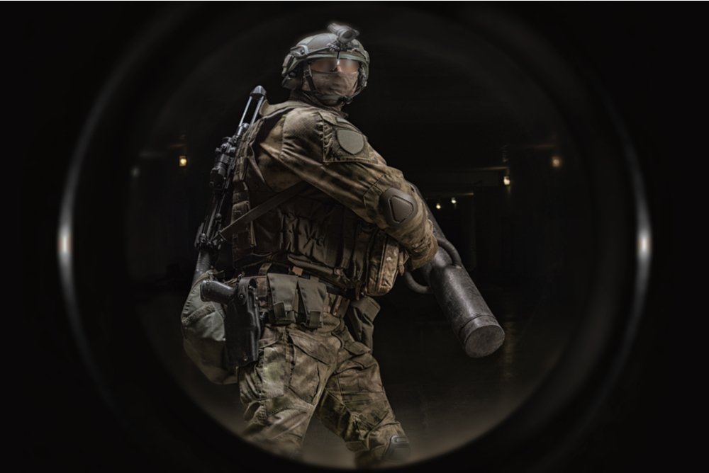 military uniformed officer with battering ram (enforcer) ready to knock down the door of a known bitcoin hodler (sarcasm) 