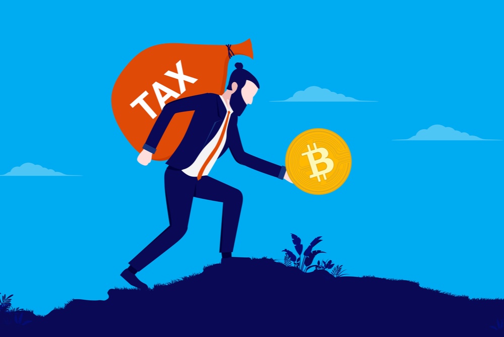 man holding bitcoin with heavy burden of tax on his back 