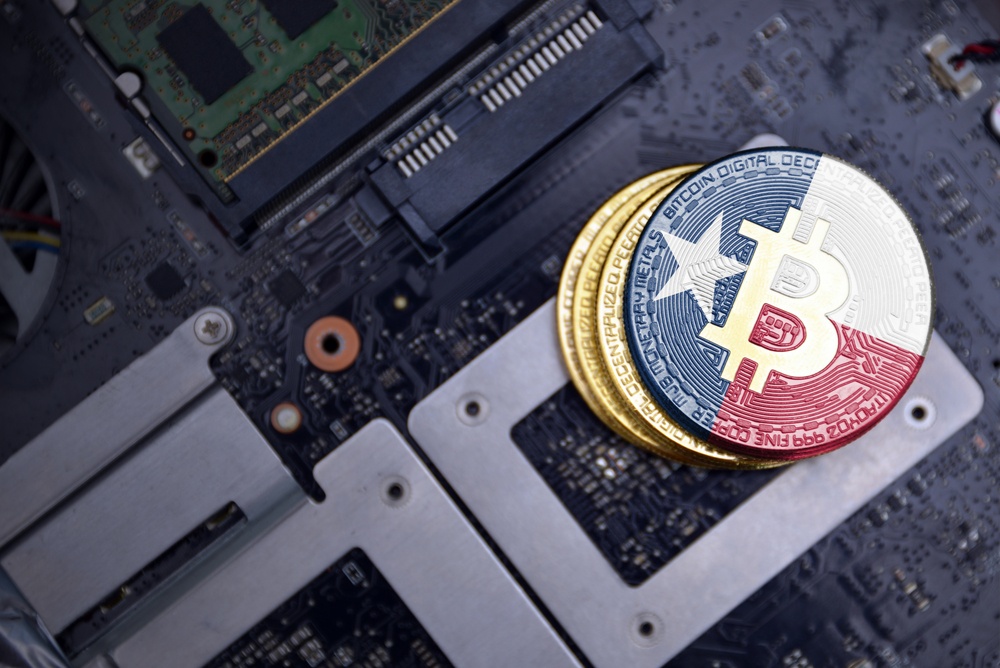 physical bitcoins on computer chip. Bitcoin are painted with Texas flag design. Bitcoin is thriving in Texas 