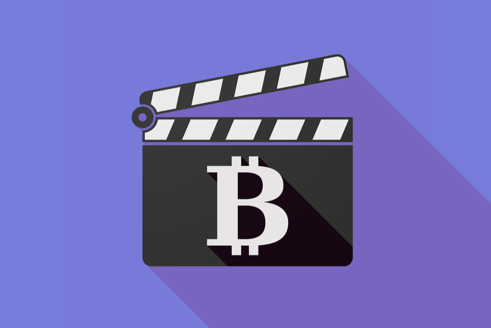 bitcoin sign on movie clapboard on purple background. bitcoin documentaries and films 