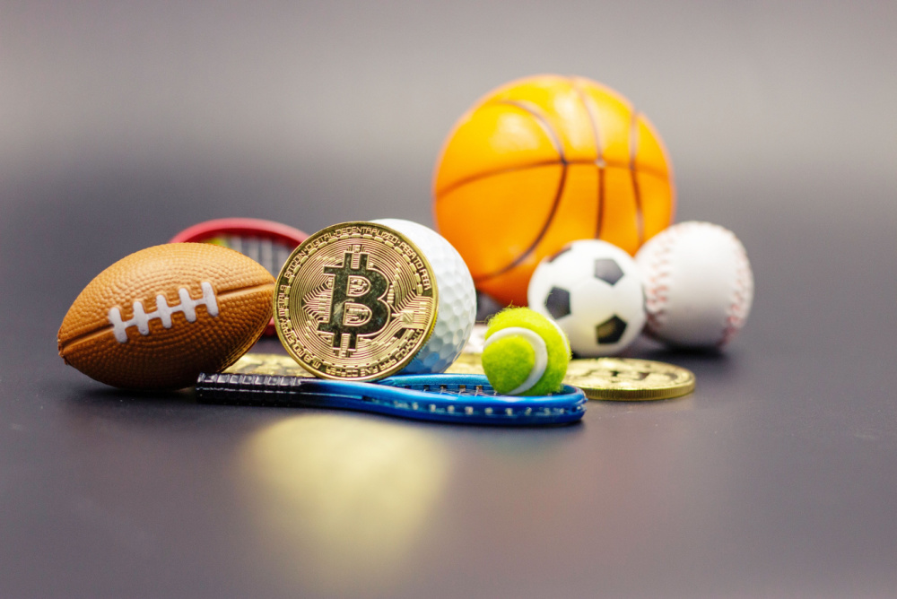 variety of miniature sports balls with a bitcoin coin 