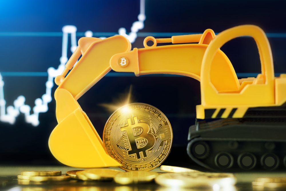 Invest In Bitcoin Mining. excavator scooping bitcoin. stock chart rising in the background.  